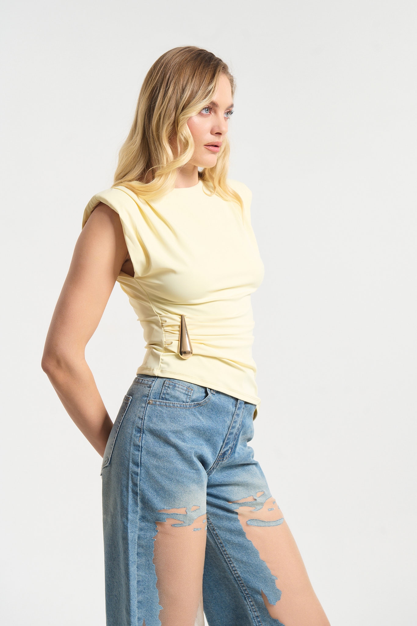 Sleeveless Top Featuring Shoulder Pads and Gold Teardrop Detail