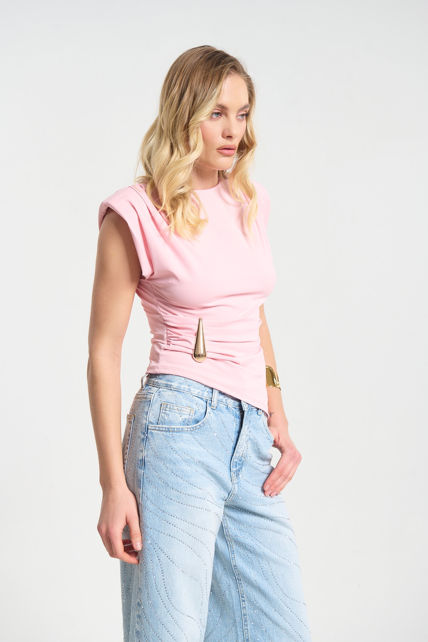 Sleeveless Top Featuring Shoulder Pads and Gold Teardrop Detail